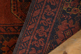 Intact charcoal side cord selvage on a vintage Afghani Bokhara rug.