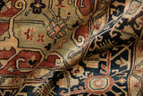 Intricate copper, charcoal navy, and sea foam green floral vinery on the Serapi rug.