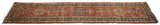 Central column of medallions showing inverted coloration on the runner's red field with dragon motifs.