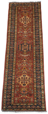 Angled view of a Pakistani Caucasian runner, highlighting its cherry red field and single column of medallions.