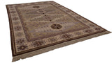 Siberian Caucasian design rug's crab style border with floral guls in beige, mauve, brown.