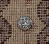 Hand-knotted Siberian Caucasian rug pile detail, full height with beige, mauve, and brown tones.