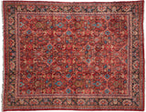 Vintage Mahal carpet in ruby red with a Herati-style floral lattice and a complex navy border.