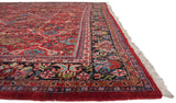 Original red selvage and floral border of a vintage Persian Mahal carpet with a full, plush pile.