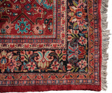 Full pile height and original side cord selvage on the corner of a vintage Persian Mahal carpet.