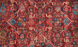 Lattice-oriented shadow panel design with gem-like ruby and turquoise on a vintage Mahal carpet.