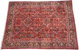 Vintage Mahal carpet with a ruby red field featuring a Herati-style lattice in gem-like tones.