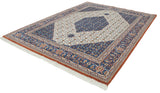 Indian Bijar rug's denim blue medallion with inverted Herati pattern on ivory field.