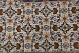 Ivory field showcasing the Herati design motif in denim blue, rust, and olive.