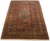 Corner of the Indian Bijar rug featuring ornate navy, gold borders and copper field.