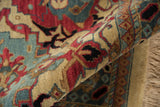 Vintage Tea Washed Agra carpet pile, showing cherry red palmettes, dusty blue motifs, and beige fringe.