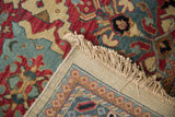 Intact fringe, side cord selvedge, and hand-knotted woven back of the vintage Agra carpet.