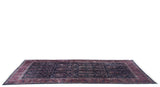 Long view of a collector's Persian Sarouk showing the scale and unidirectional Mille Fleur design.