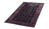 Angled view of a vintage Sarouk carpet, highlighting the grand scale of its unidirectional floral pattern.