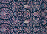 Detailed Mille Fleur pattern with potted vases on a vintage Persian Sarouk carpet's indigo field.