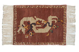 Vintage hand-knotted Armenian pictorial rug with aubergine field, ivory dragon, cloud-band, and vine border.