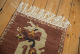 Fringe, meandering vine border, and ivory cloud-band dragon on the vintage Armenian rug.