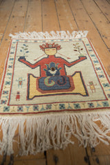 Vintage pictorial Armenian rug, figural personage holding germinating Tree of Life plant, floral border.