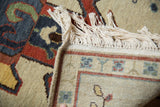 Hand-knotted fringe and tight reverse weave showing the border design of the Armenian rug.