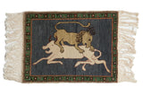 Pictorial Armenian hunting scene rug with lion, dark blue field, green border, 1'10