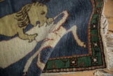 Full pile height, forest green border, and ivory fringe on the Armenian rug.