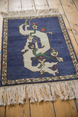 The full pile and sprawling ivory dragon design on a vintage Armenian square rug.