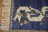 Corner of the vintage dragon rug showing the full pile, clean ivory fringe, and meandering vine border.