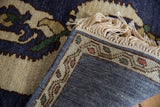 The hand-knotted back, secure side cord selvage, and ivory fringe of a vintage Armenian rug.