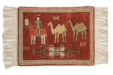 Vintage Armenian pictorial rug depicting a herdsman with his horse and camels on a rust red field.