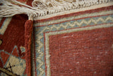 Secure side cord selvage and hand-knotted back of the vintage Armenian pictorial rug.