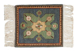 Vintage Yerevan square rug mat with a floral starburst medallion, blue field, and zig-zag border.