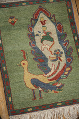 Saffron yellow peacock body, rust boteh border, and ivory fringe on vintage pictorial rug.