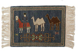 Vintage pictorial Armenian rug: herdsman, camels, primitive florals, denim blue, chevron border.