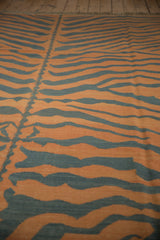 Detailed tiger stripe kilim showing pale rust, charcoal abrashes, and central spine.