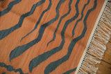 Vintage hand woven tiger kilim fringed end featuring pale rust and charcoal stripes.