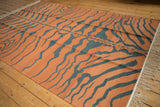Vintage Indian Tiger Kilim rug with terracotta and charcoal abrashed tiger stripes and fringe.