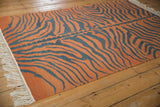 Burnt orange and charcoal tiger stripe vintage Indian Kilim rug, with subtle abrashes.