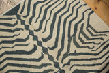 Vintage hand woven Kilim rug with abstract zebra stripes in ivory and dusty navy, featuring corner fringe.