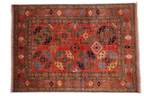 Hand knotted Pakistani Ersari design rug with deep red field and bold gem-toned geometric guls.