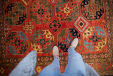 Detailed geometric Ersari guls and palmettes in rich cherry red, sapphire blue, emerald green.