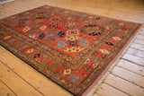Ersari design geometric guls in cherry red, sapphire blue, and emerald green.