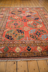 Cherry red field with bold Ersari geometric guls and intricate gem-tone borders.