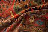Bold geometric guls and cross motifs in cherry red, blue, and emerald green.