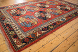 Ersari design border with geometric guls in cherry red, sapphire blue, and emerald green.