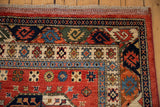 Ersari rug with cherry red field, sapphire blue guls, and intricate cream borders.