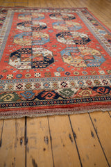 Hand-knotted fringe and geometric border detail on the Pakistani Ersari design rug.