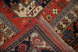 Ersari design rug corner with fringe, red selvage, and bold geometric guls.