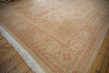 Vintage Distressed Indian Soumac rug: floral palmettes, patterned border, and ivory fringe.