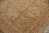Hand-woven Soumac carpet's distressed texture, with beige, dusty rose vinery and fringe.
