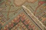 Textured Soumac weave, ivory fringe, and geometric corner border of vintage Indian rug.